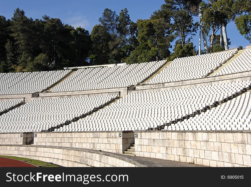Empty stadium with lots of white chairs. Empty stadium with lots of white chairs