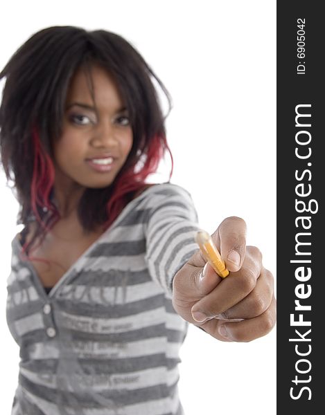 Young girl showing pencil on an isolated white background