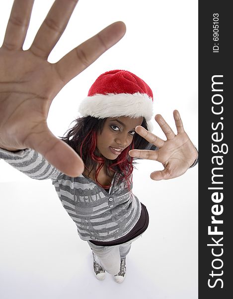 Standing african girl with christmas hat on an isolated white background