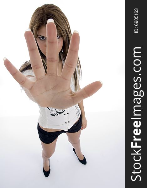 Standing female showing her fingers on an isolated background