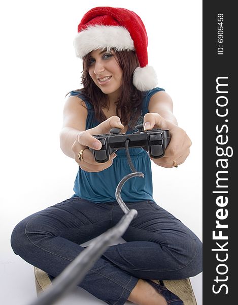 Young woman with remote and christmas hat on an isolated white background