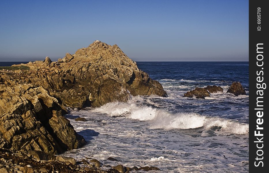 This is a picture of the rocky Pacific coast from Monterey's coast.