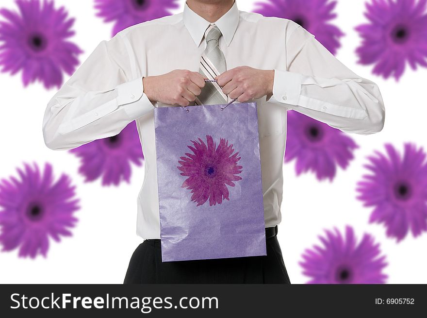 Man keeps in the palm the purple paper bag. Man keeps in the palm the purple paper bag