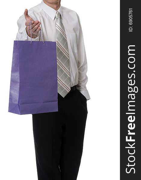 Man keeps in the palm the purple paper bag. Man keeps in the palm the purple paper bag