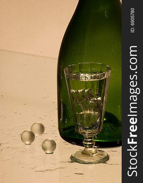 Glass With Champagne And Bottle