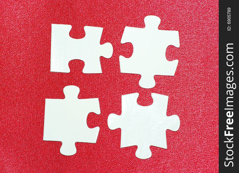 White puzzles isolated on a red