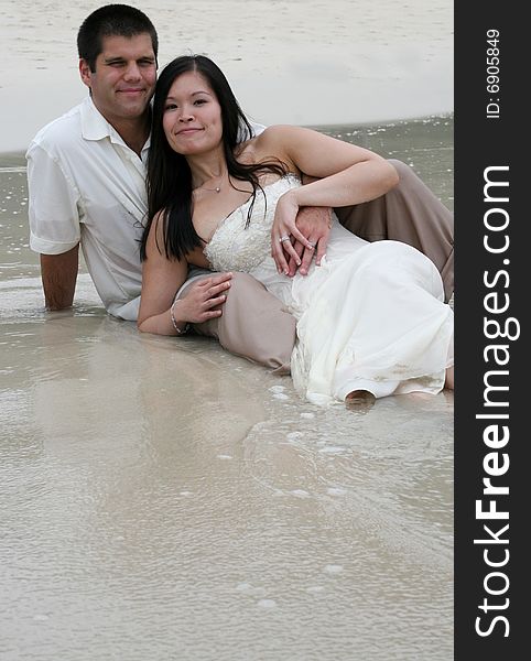 Young couple playing at the beach. Young couple playing at the beach.