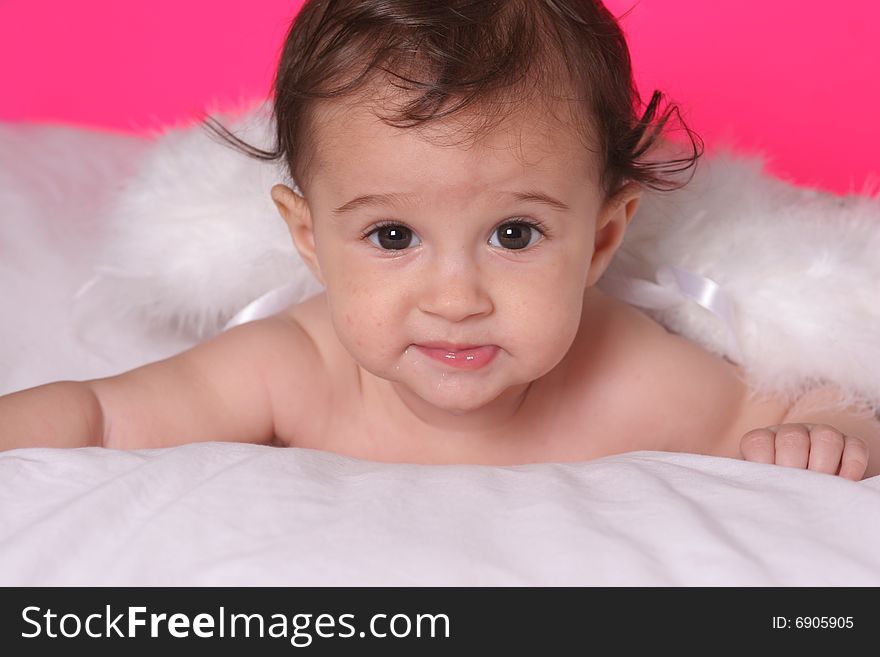 Cute baby girl withangel wings on pink background. Cute baby girl withangel wings on pink background