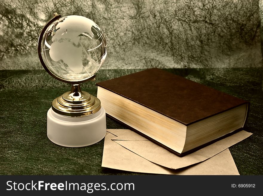 Glass globe and the old book