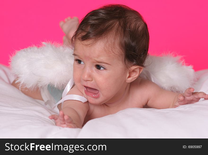 Cute baby girl withangel wings on pink background. Cute baby girl withangel wings on pink background