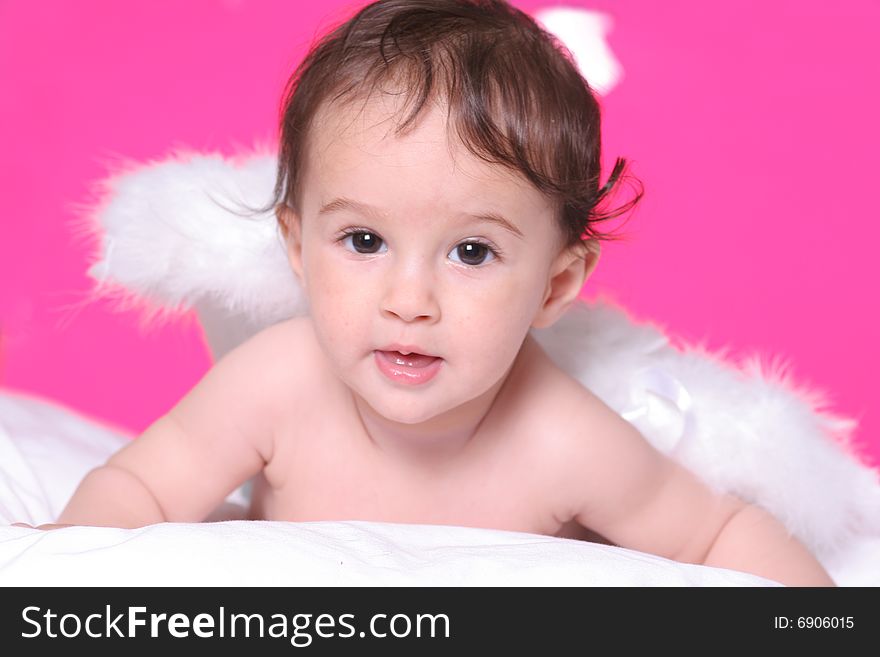 Cute baby girl withangel wings on pink background. Cute baby girl withangel wings on pink background