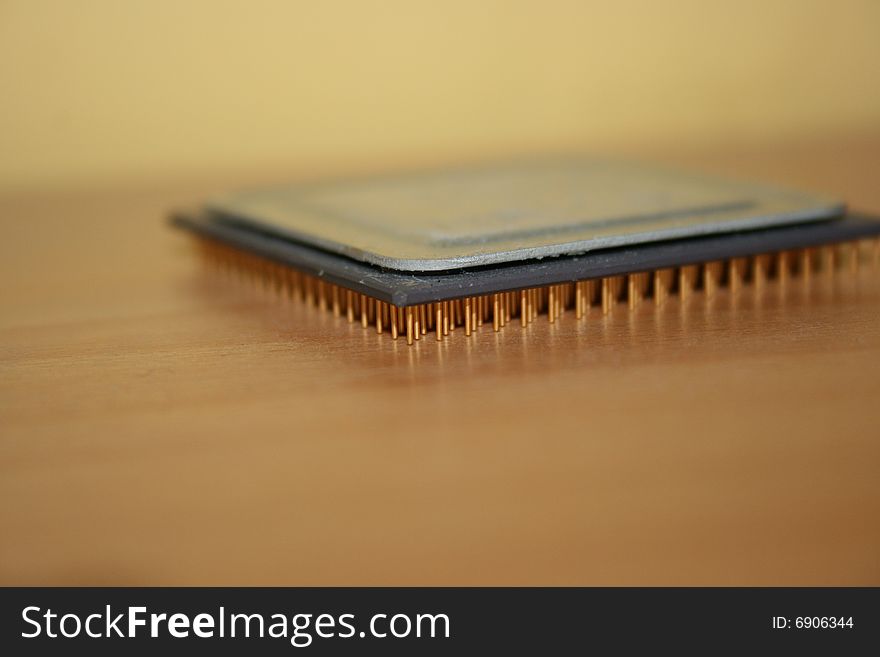 A processor on a wooden table. A processor on a wooden table