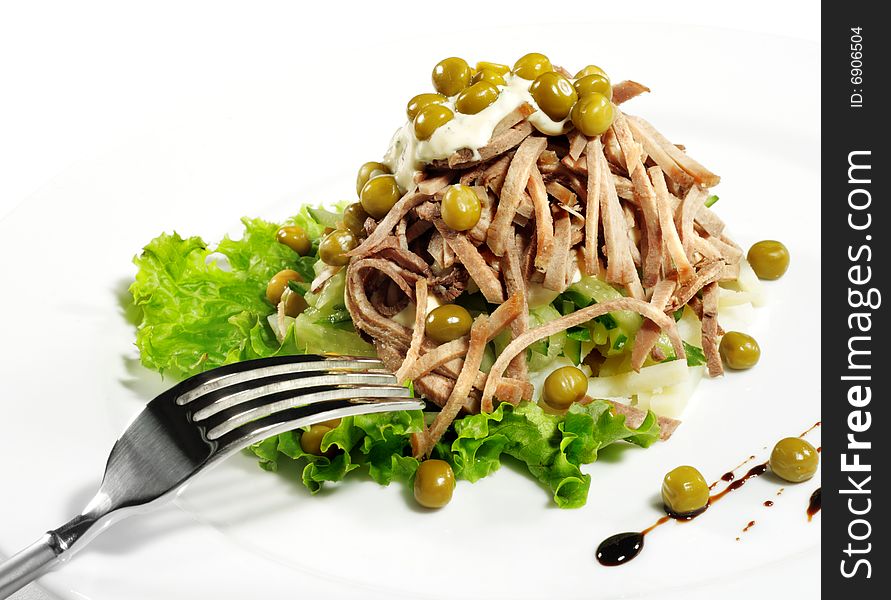 Green Peas and Meat Salad Served with Salad Leaves and Sauce. Isolated on White Background