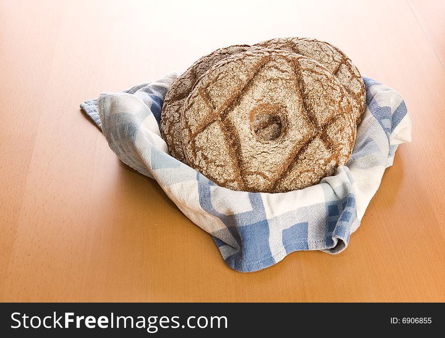 Fresh round rye bread on table