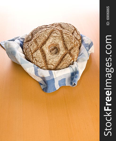 Fresh round rye bread on table