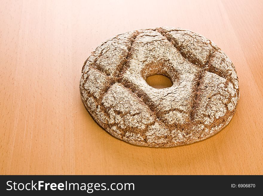 Fresh round rye bread on table