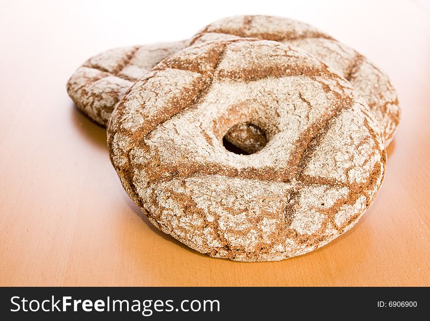 Fresh round rye bread on table