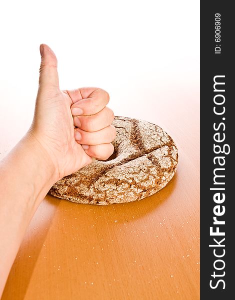 Fresh round rye bread on table