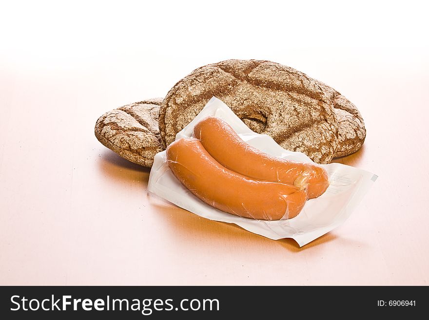 Fresh round bread with sausage. Fresh round bread with sausage