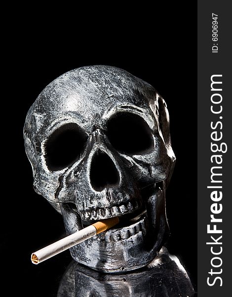 Human skull smoking a cigarette. Human skull smoking a cigarette