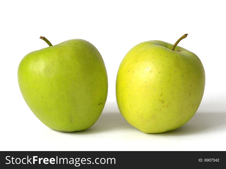 Two green apples isolated over white