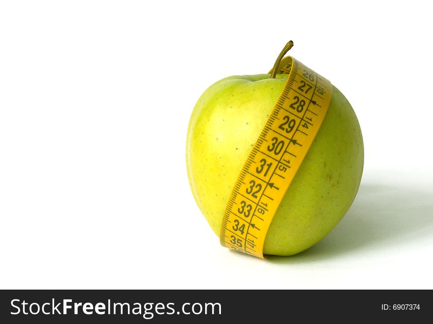 Green Apple with tape metre isolated over white