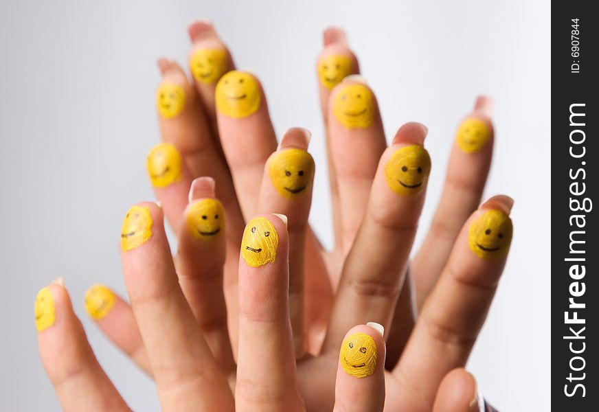 Group of smiling happy fingers over grey background. Group of smiling happy fingers over grey background
