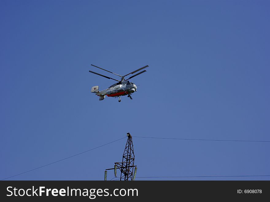Helicopter which will fly over the thrust electricity transmission