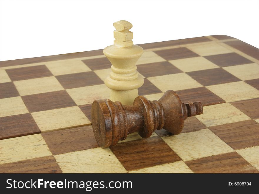 Chess, black king lay down on the chessboard. Chess, black king lay down on the chessboard