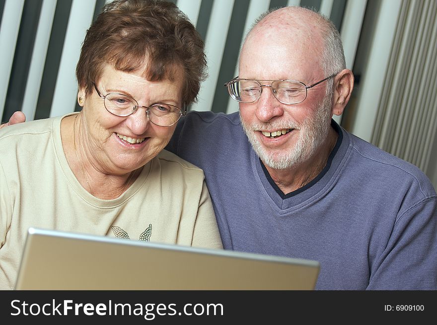 Senior Adults on Working on a Laptop Computer. Senior Adults on Working on a Laptop Computer