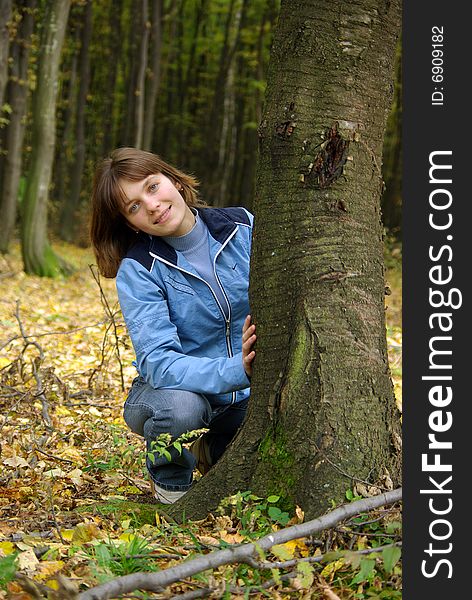 Girl in the forest near the tree. Girl in the forest near the tree.