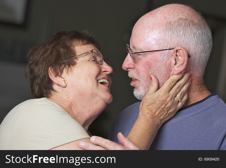 Happy Senior Adult Couple Facing Each Other