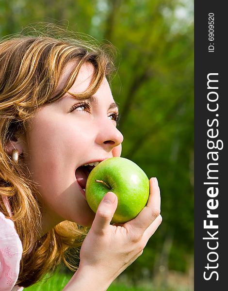 Pretty Woman Eating Green Apple