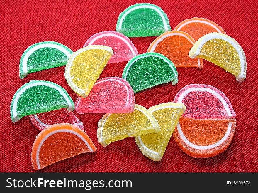 Background fruit Candy on red fabric background. Background fruit Candy on red fabric background.
