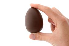 Easter Egg Between Fingers Royalty Free Stock Photos