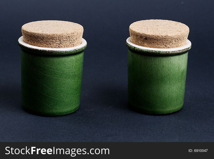 Two green jar on a black background. Two green jar on a black background