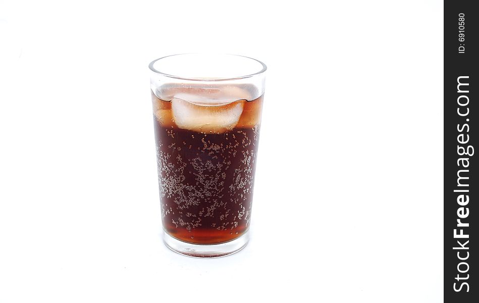 Glass of cold cola fizzy drink with ice and bubbles against a white background. Glass of cold cola fizzy drink with ice and bubbles against a white background