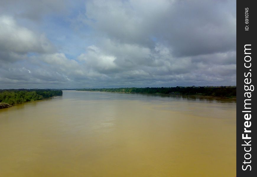 Murky River of Bintulu Sarawak with clouds hovering over it. Murky River of Bintulu Sarawak with clouds hovering over it