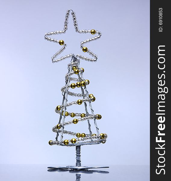 A Christmas tree made of wire and beads.