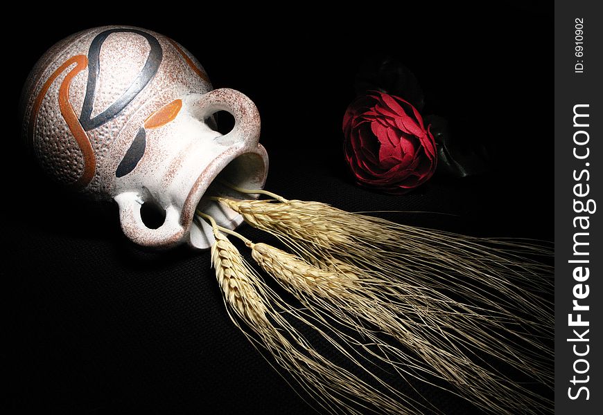 Red rose and wheat with light painting technique. Red rose and wheat with light painting technique