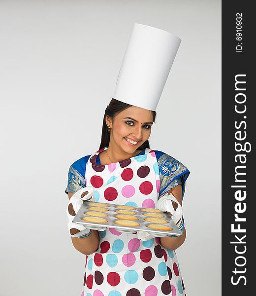 Asian Female Baker With Cookies