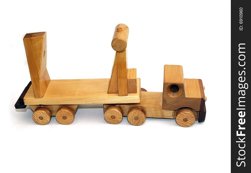 Wooden toy macktruck, side-view on white background. Wooden toy macktruck, side-view on white background
