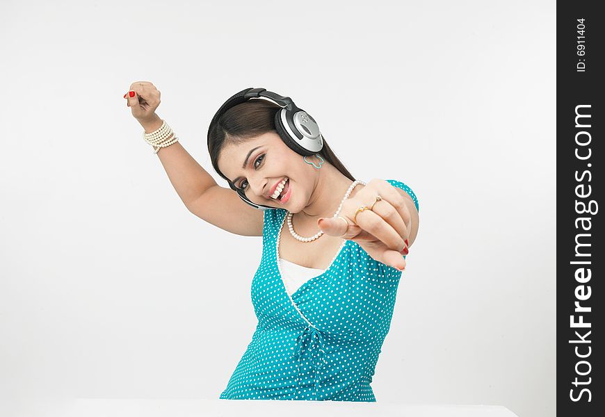 A beautiful asian female enjoying music