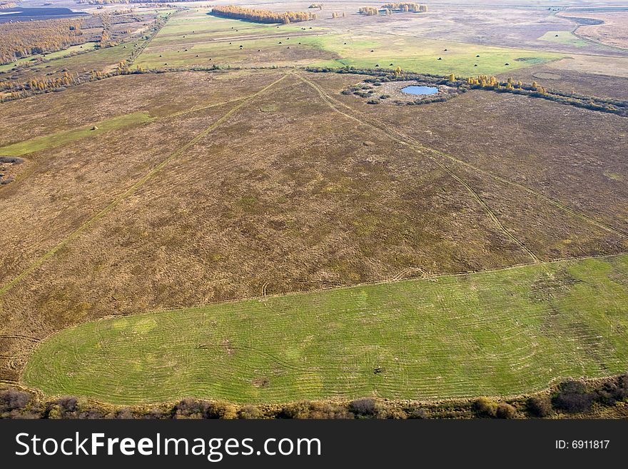 Aerial view of landscape of vast plains and forest in Siberia, Russian Federation. Aerial view of landscape of vast plains and forest in Siberia, Russian Federation.