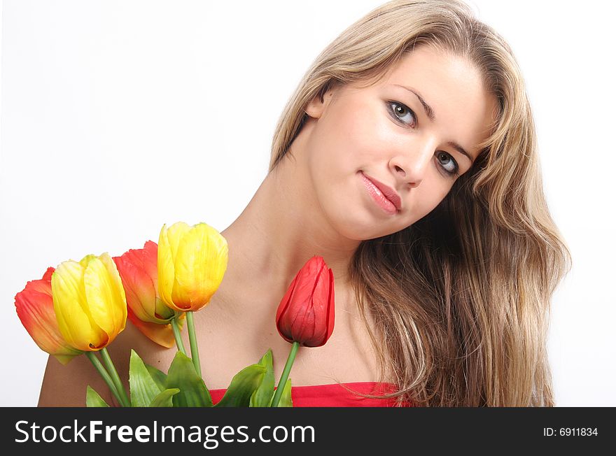 Romantic portrait of lovely young girl with  tulips