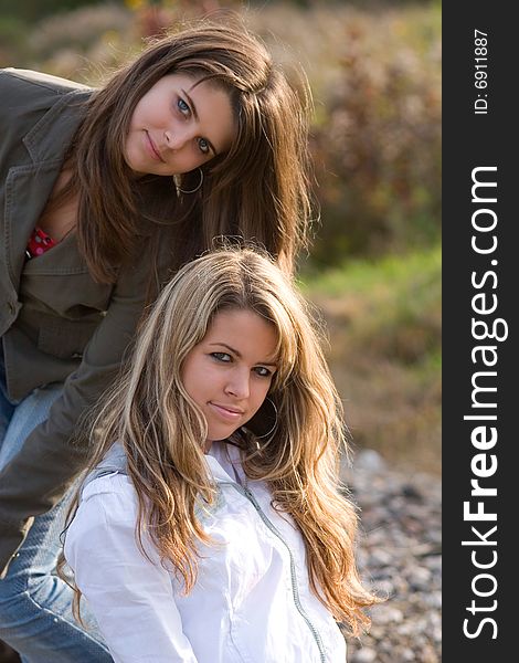 Outdoor portrait of two teenage sisters. Outdoor portrait of two teenage sisters