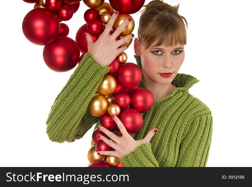 Fashion woman holding bunch of Christmas balls on white background