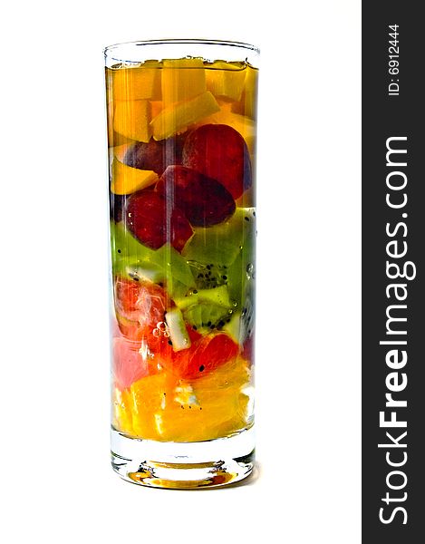 Jelly dessert with the tropical fruits in a glass. Jelly dessert with the tropical fruits in a glass