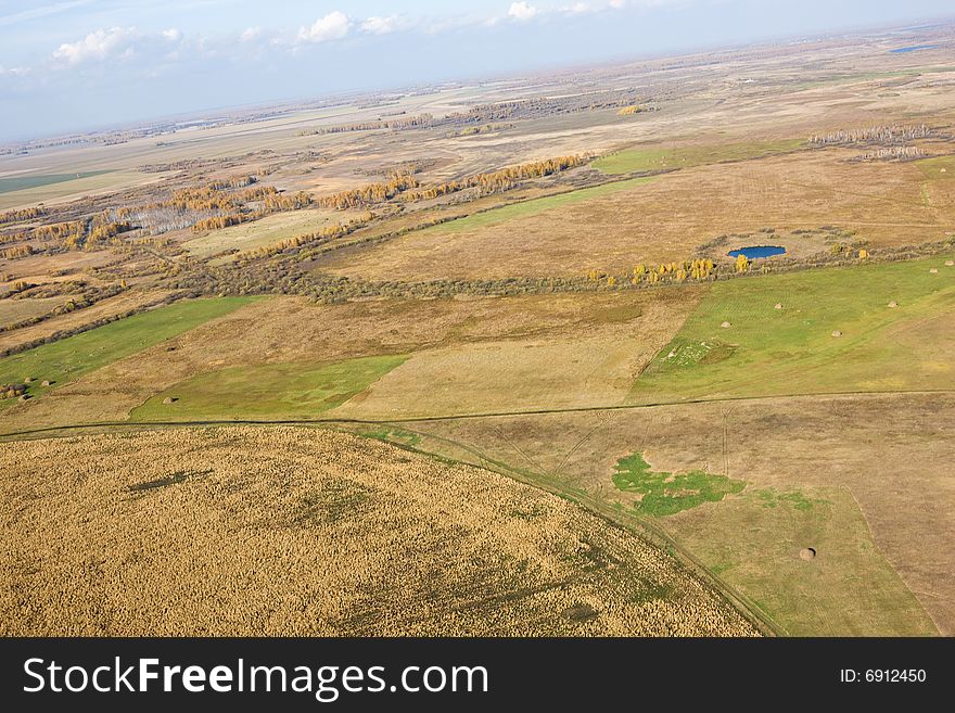 Aerial view of landscape of vast plains and forest in Siberia, Russian Federation. Aerial view of landscape of vast plains and forest in Siberia, Russian Federation.