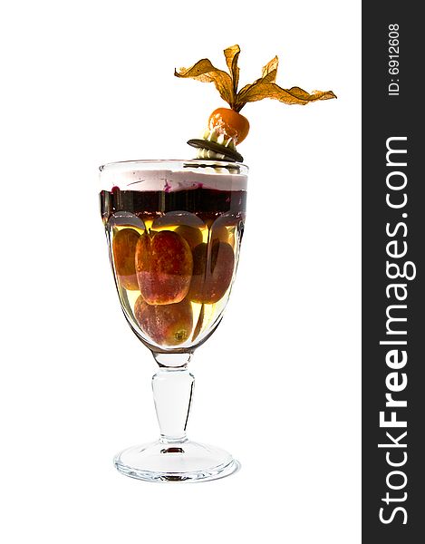 Isolated Jelly dessert with grapes in a glass. Isolated Jelly dessert with grapes in a glass